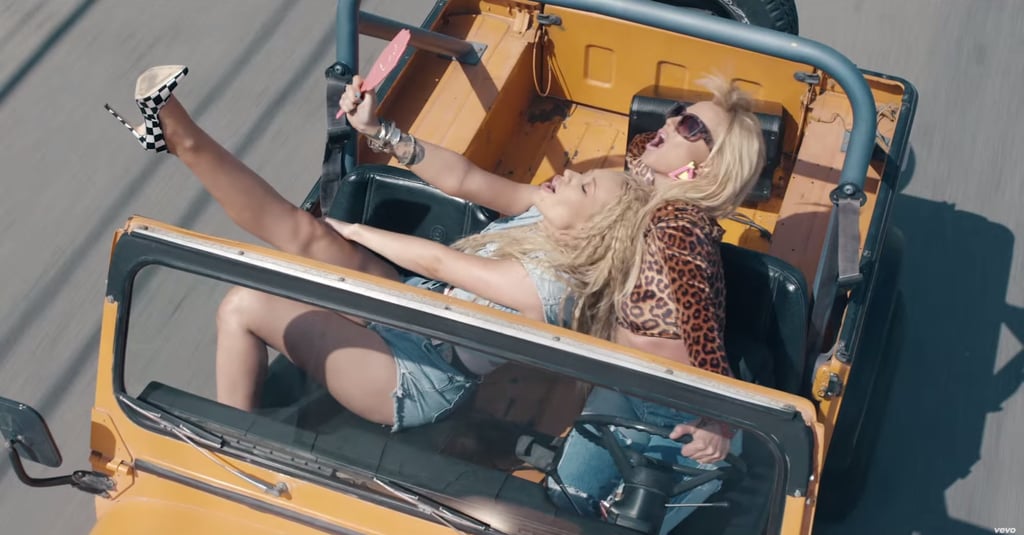 This is probably a dangerous way to drive, but we do love those black-and-white pumps!