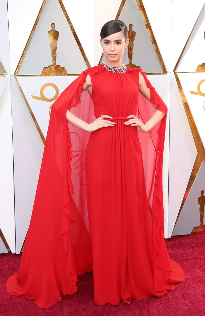 Wearing a Giambattista Valli gown with a cape at the 2018 Oscars.