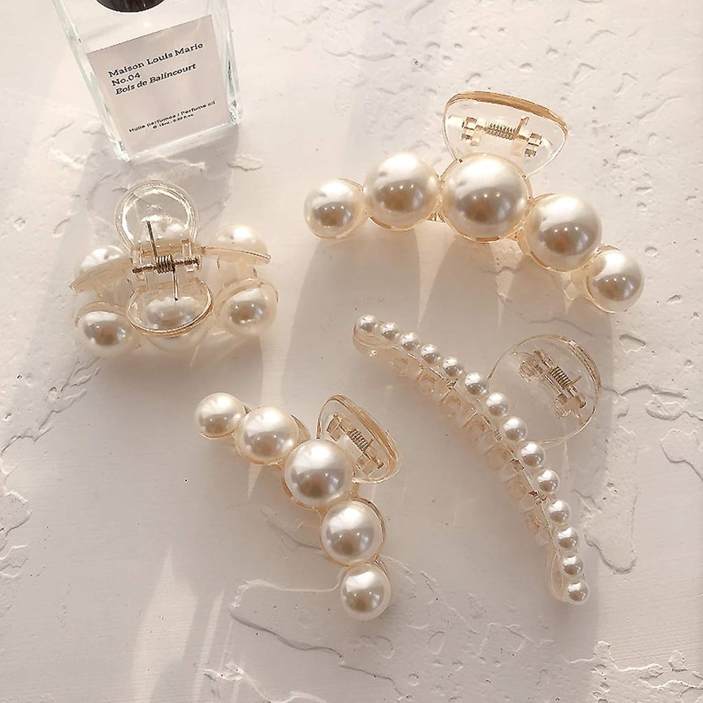 Agirlvct Pearl Hair Clip Set ($7)
The film's lead hair and makeup designer Siân Miller often included ornamental hair pins tucked in Robbie's braids, like this pearl clip set. It's an effortless nod to the coquette trend, and makes an elegant touch for any special occasion.
