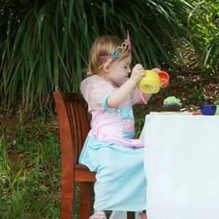 Photo of Police Officer Having Tea Party With Daughter