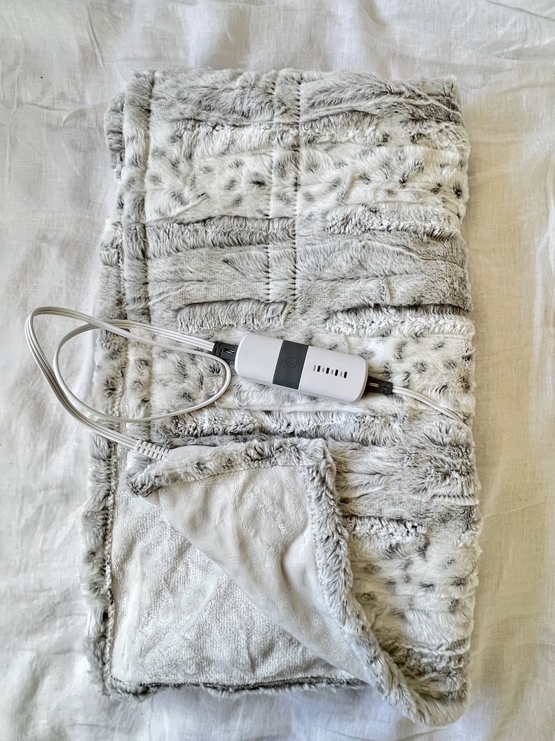 The Threshold Faux Fur Electric Throw Blanket folded with controller shown.