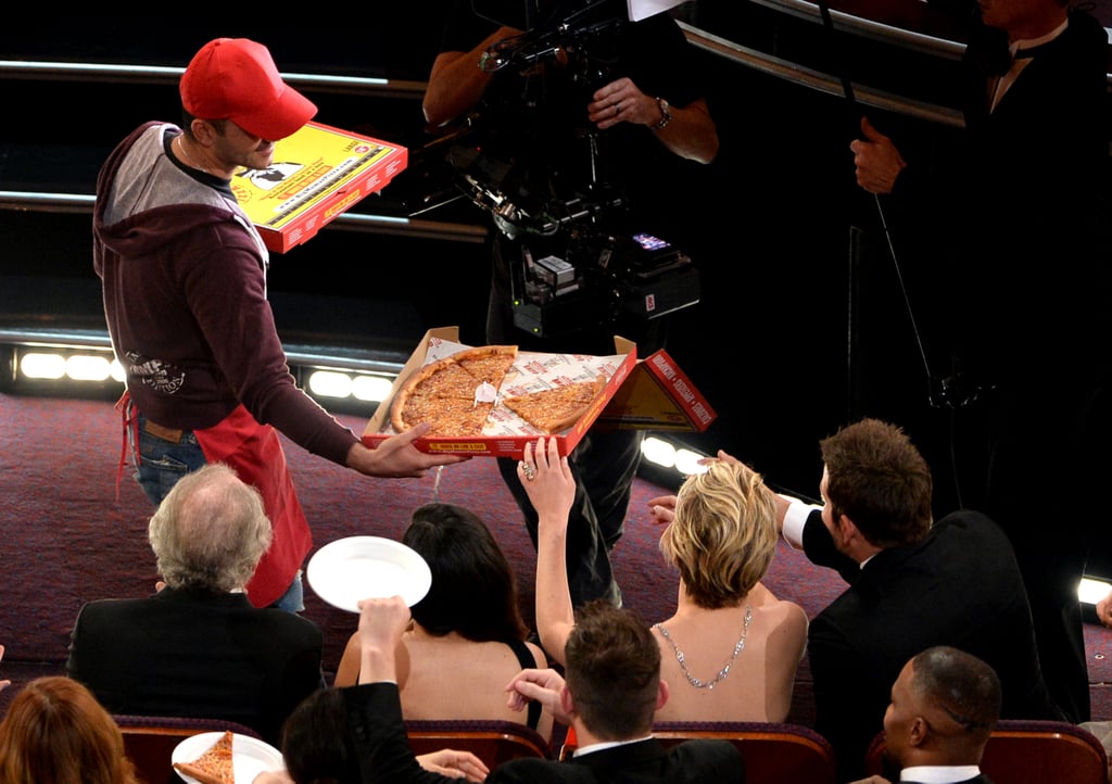 The pizza guy gave Jennifer Lawrence a pizza.
