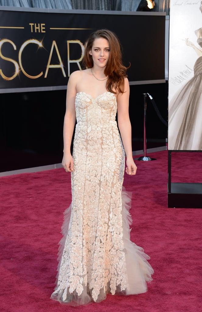 Stewart donned a pale blush Reem Acra gown featuring intricate lace detailing for the 2013 Oscars in February.