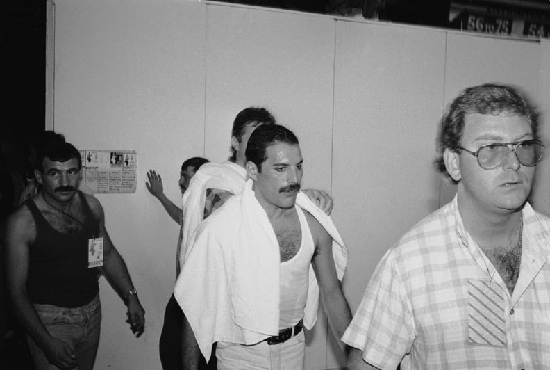 Rock star Freddie Mercury backstage at the Live Aid concert at Wembley, 13th July 1985. On the left is his boyfriend Jim Hutton. (Photo by Dave Hogan/Hulton Archive/Getty Images)