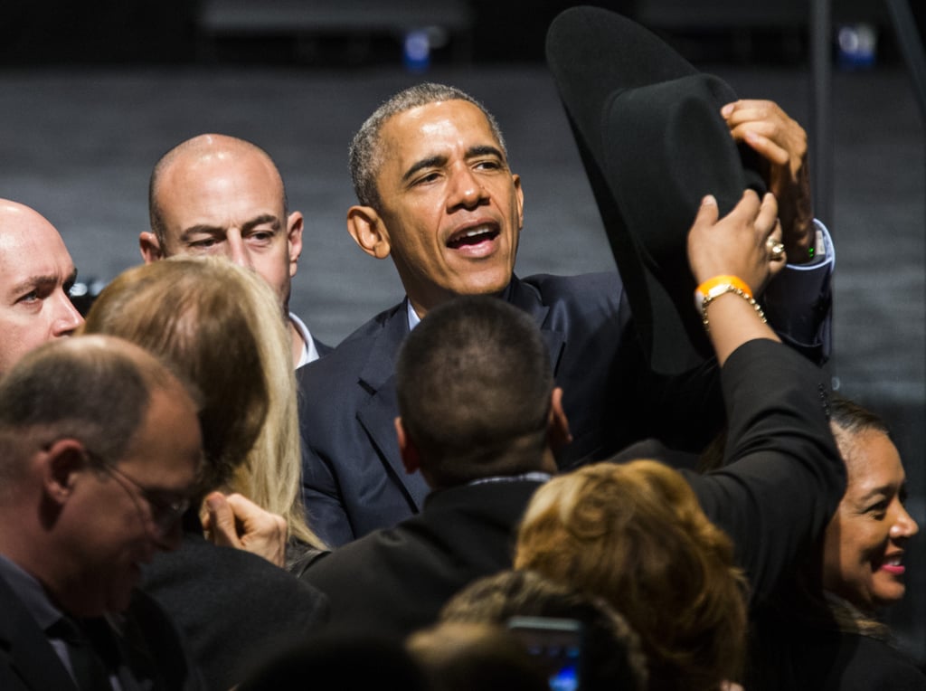 Borrowing a cowboy hat at a Texas Democratic National Committee event in 2016.
