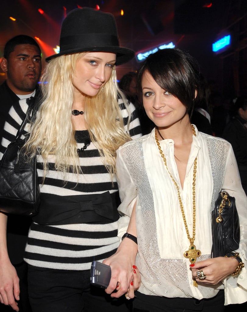 A dark-haired Nicole stuck close to her pal Paris Hilton during an LA soirée in November 2006.