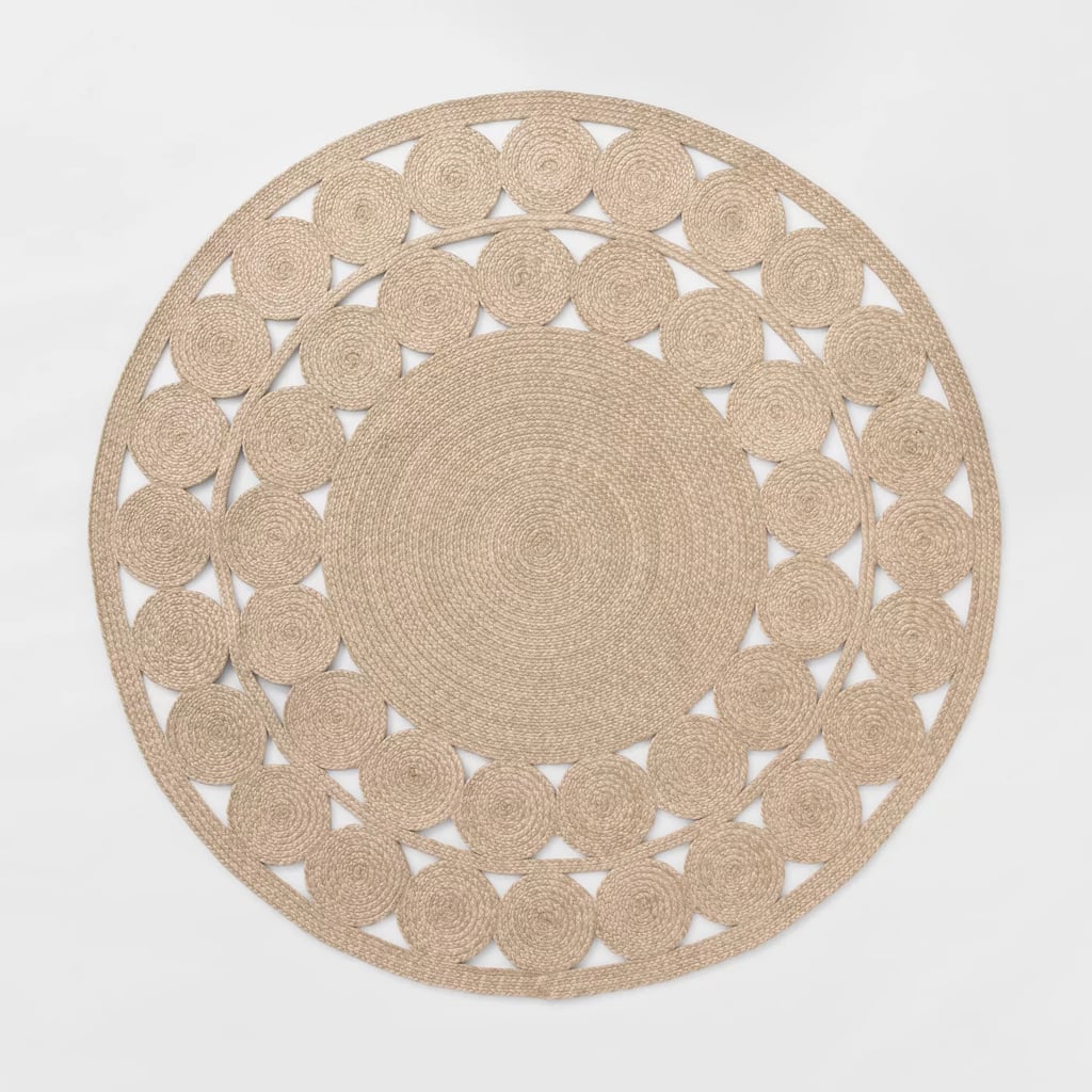 A Braided Outdoor Rug: Round Ornate Woven Outdoor Rug