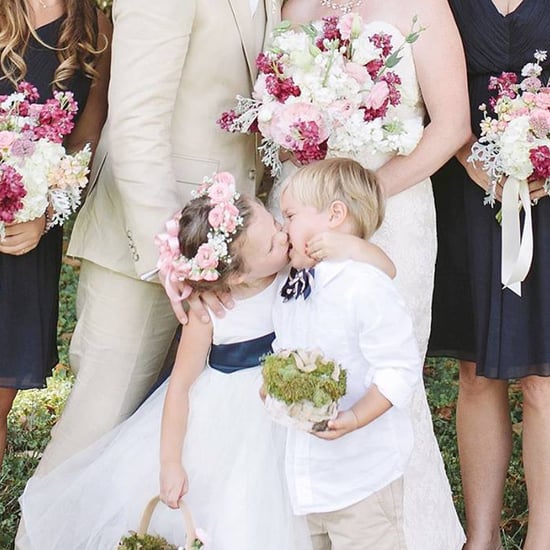 Flower Girl Kisses Ring Bearer in Wedding Photo