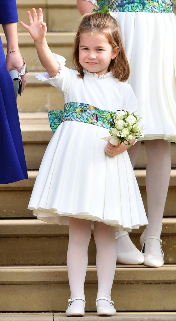 Princess Charlotte was seen in a white dress with a colourful belt detail as she attended Princess Eugenie's wedding in 2018.