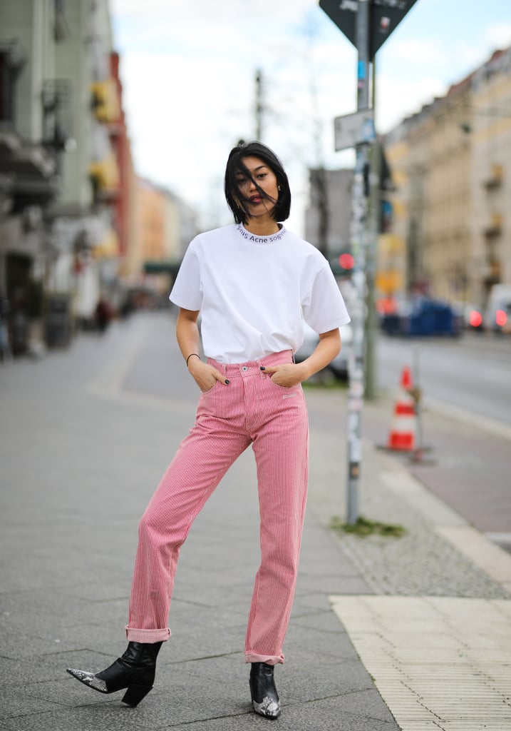 Style a white tee with red striped jeans.