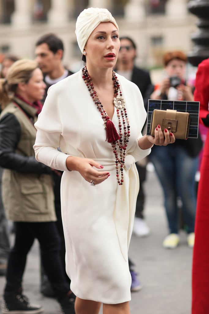 A turban injected just a little whimsy into a sophisticated, creamy white wrap dress.
A turban injected just a little whimsy into a sophisticated, creamy white wrap dress.