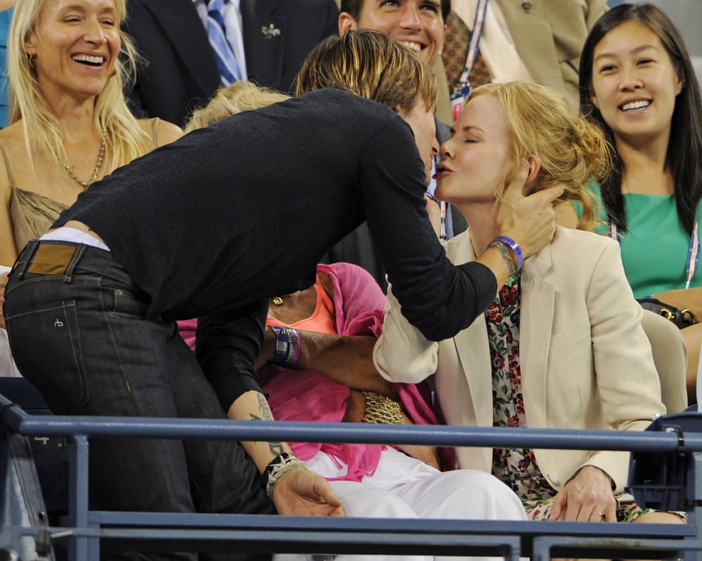 Nicole Kidman and Keith Urban snuck a kiss while watching the US Open in NYC in August 2012.