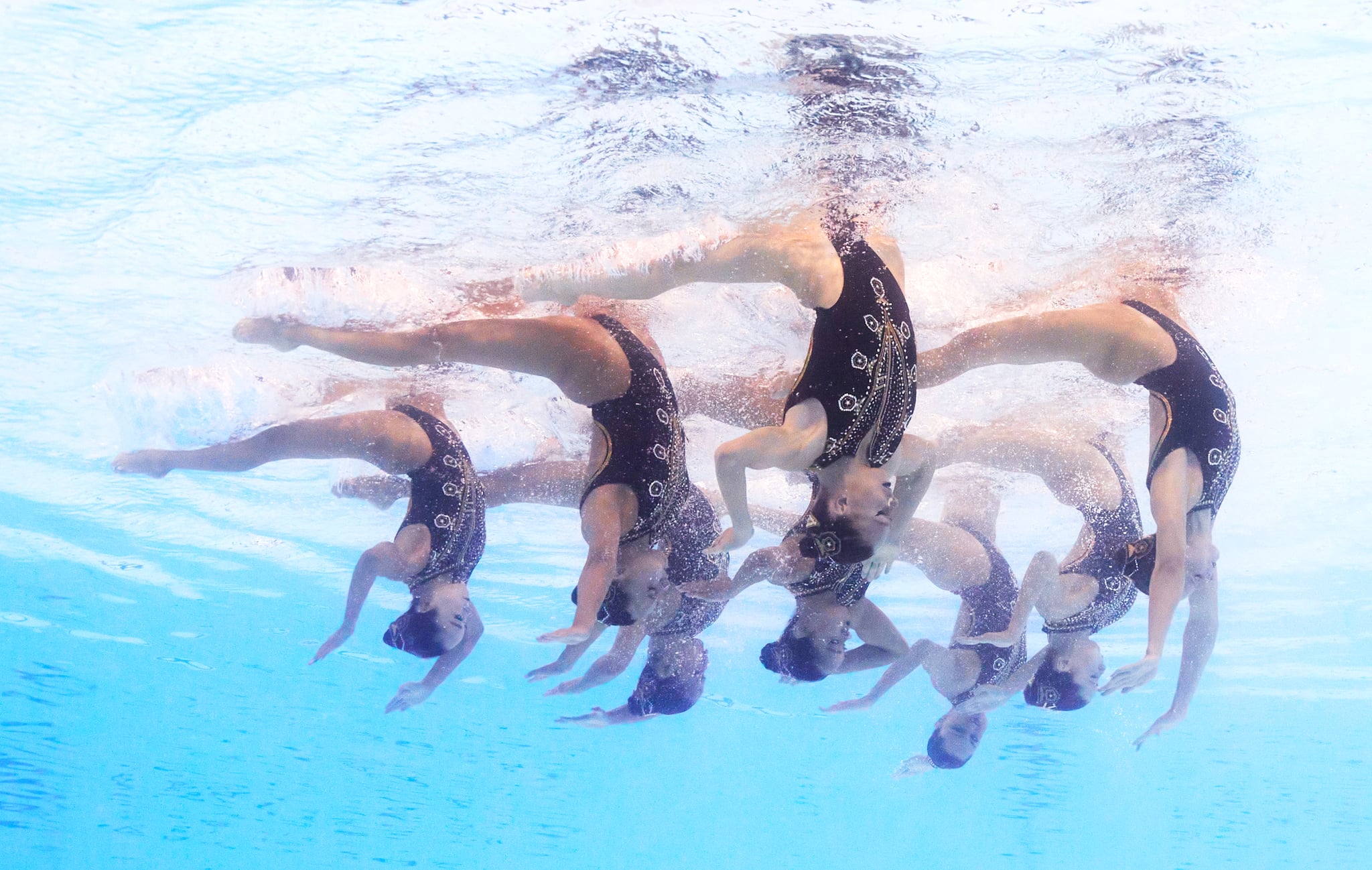 PARIS, FRANCE - AUGUST 05: (EDITORS NOTE: Image was captured using an underwater robotic camera.) Members of Team United States compete in the Team Technical Routine on day ten of the Olympic Games Paris 2024 at Aquatics Centre on August 05, 2024 in Paris, France. (Photo by Maddie Meyer/Getty Images)