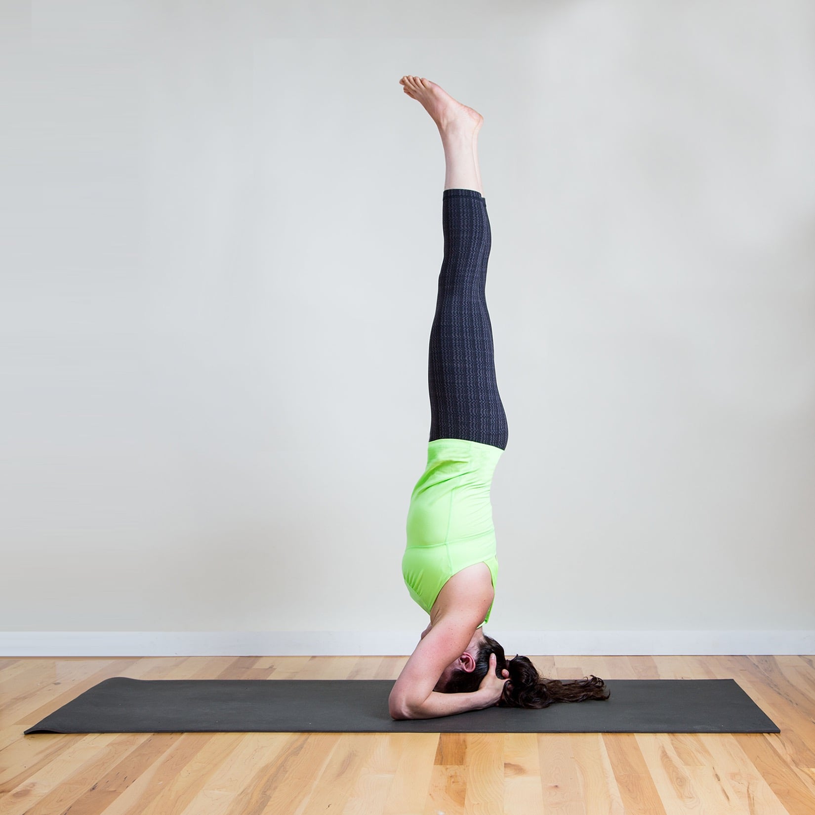 Back view female stretching legs in the air, demanding yoga pose Stock  Photo | Adobe Stock