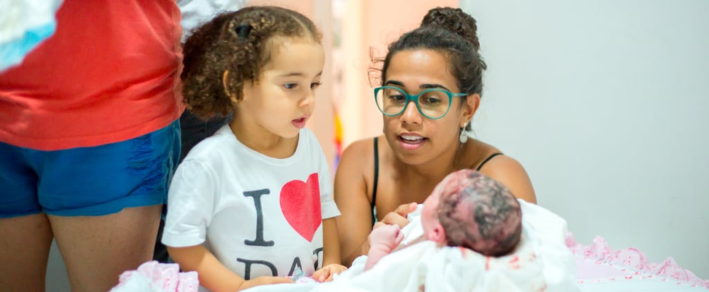 Birth Photographer Captures a Girl's Awe as She Meets Her Little Sister For the First Time