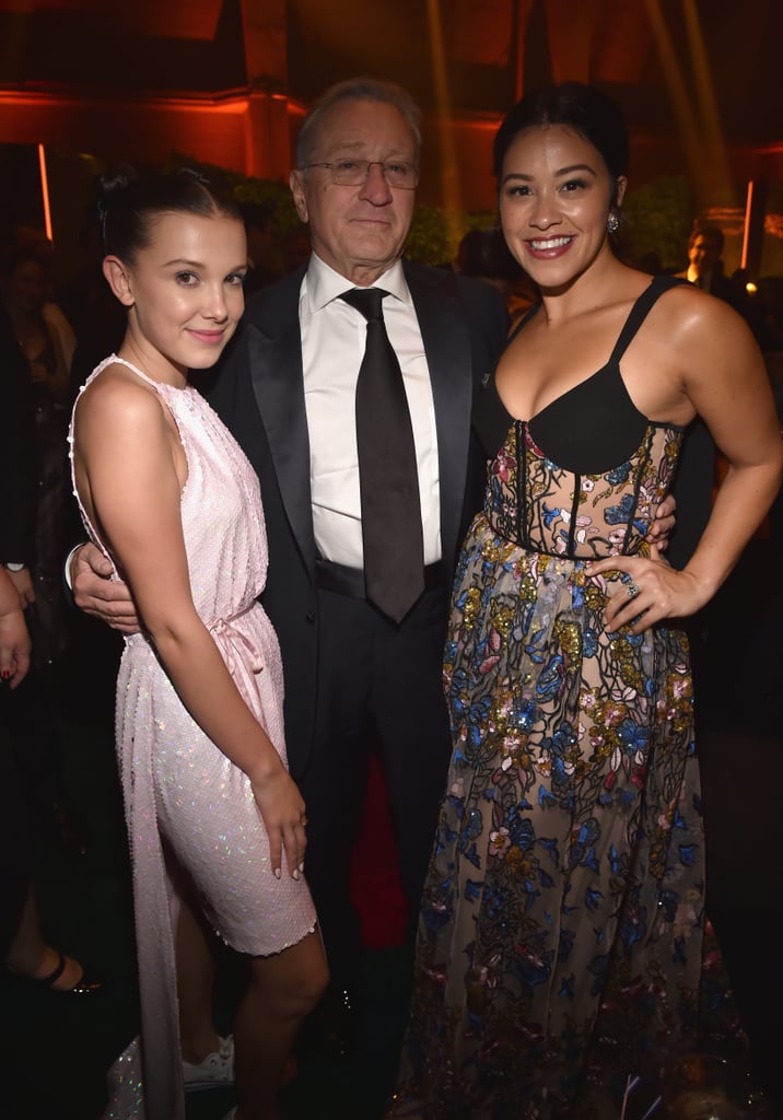 Pictured: Millie Bobby Brown, Robert De Niro, and Gina Rodriguez