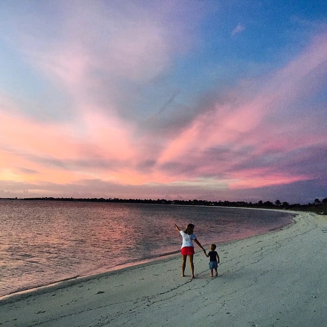 The mother and son took in a beautiful sunset.