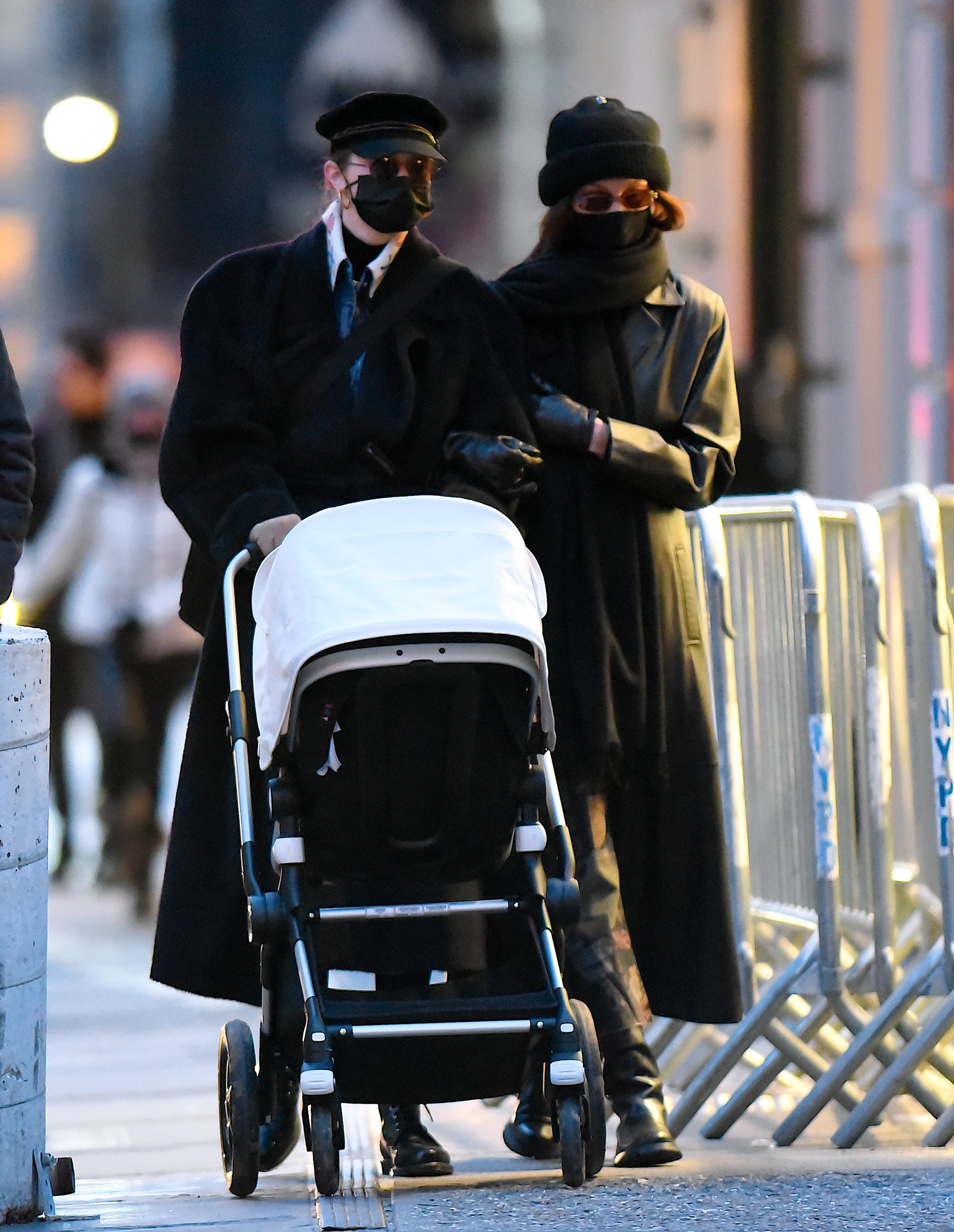 Gigi Hadid takes her daughter out for a stroll during a lunch outing with  Bella Hadid