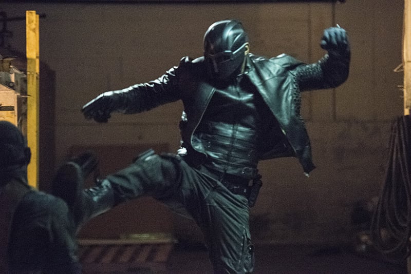 Yep, that's Diggle! His alter ego hasn't been revealed, but he might be a version of the Guardian.