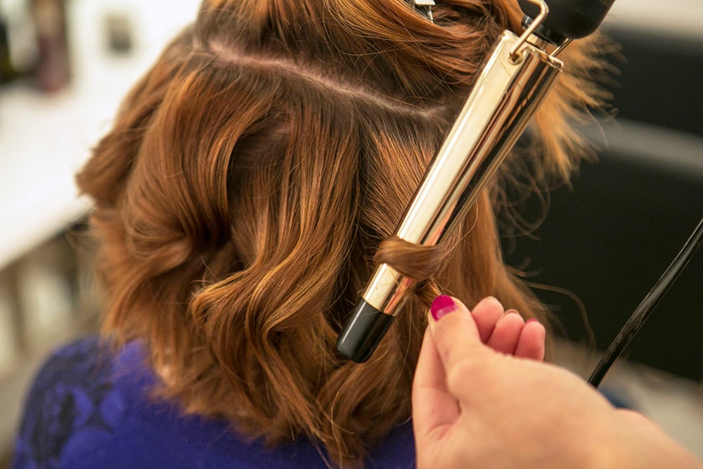 Add in more waves. Huffnagle likes to curl in opposite directions to give the hair more volume and a more natural look than curling each section in the same direction.