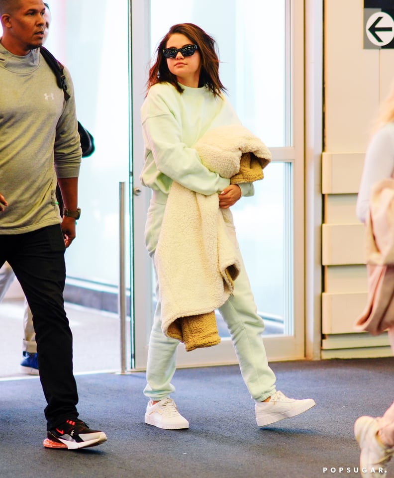 Selena Gomez Green Sweatsuit at Airport 2019 | POPSUGAR Fashion