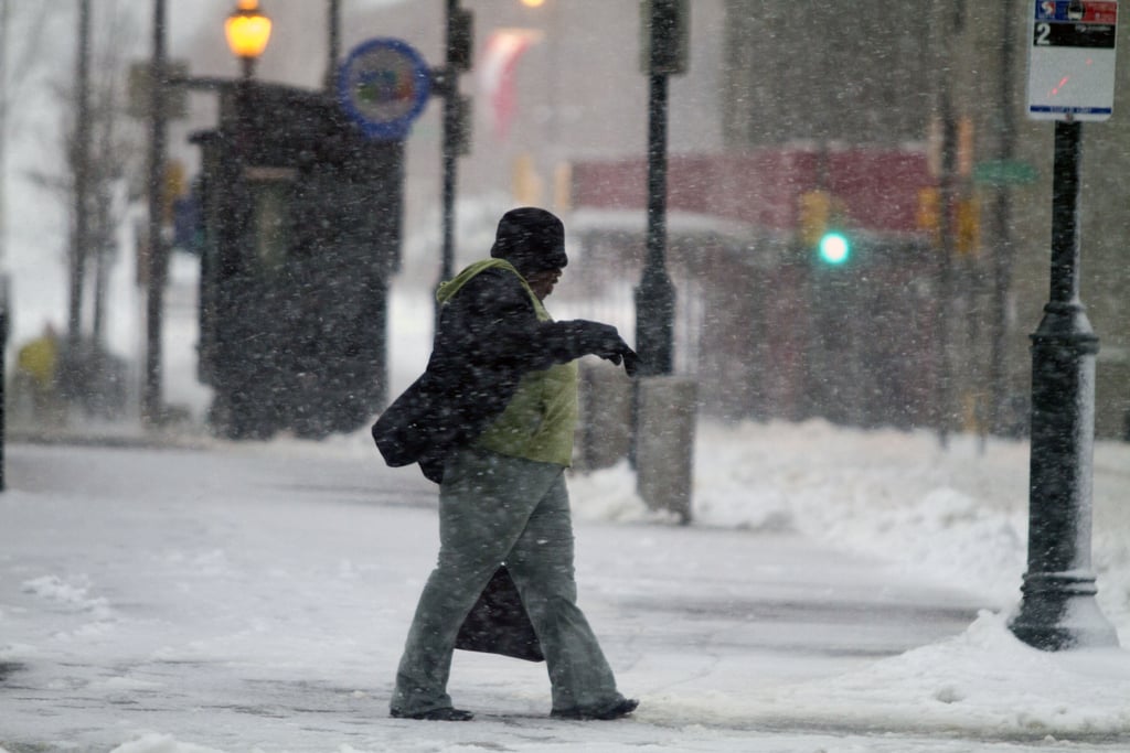 A Philadelphia, PA, resident wore a full face mask to handle the cold.