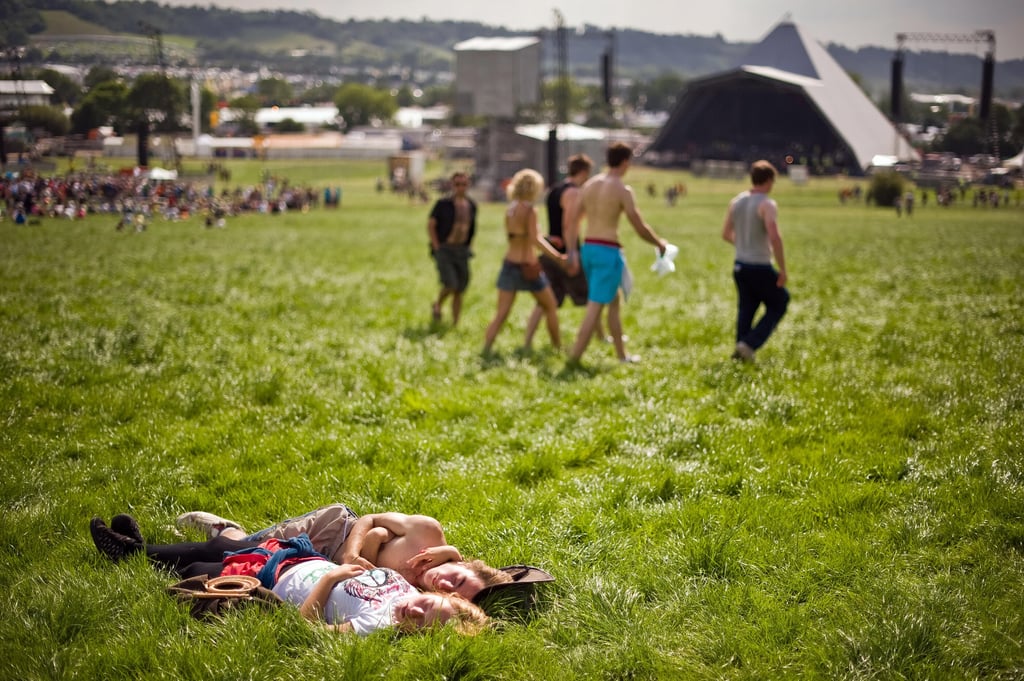 A couple soaked up the sun in the grass at the annual Glastonbury festival in England.
A couple soaked up the sun in the grass at the annual Glastonbury festival in England.
