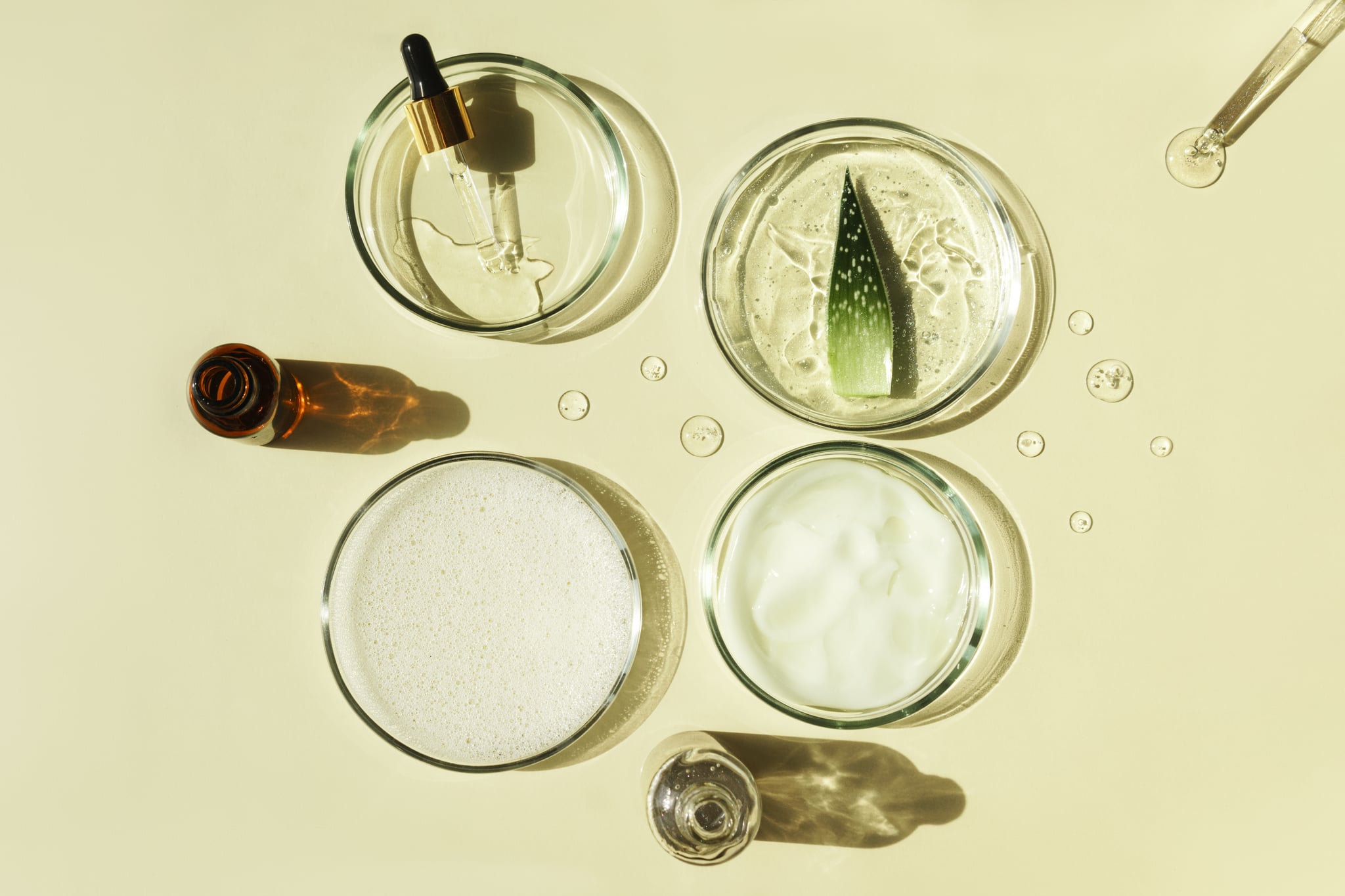 Skin care. Aloe vera gel and aloe vera leafs on white background top view copyspace