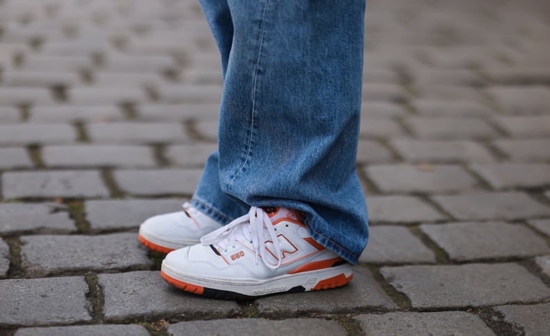 BERLIN, GERMANY - MAY 25: Sonia Lyson wearing Weekday denim wide pants, New Balance 550 white and orange sneaker on May 25, 2022 in Berlin, Germany. (Photo by Jeremy Moeller/Getty Images)