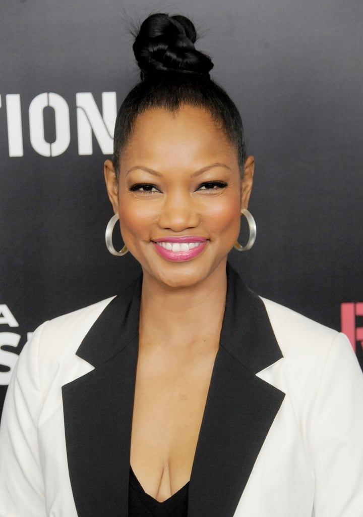 For a similar basket-weave look like Garcelle Beauvais, plait your high ponytail before twisting it into a knot.