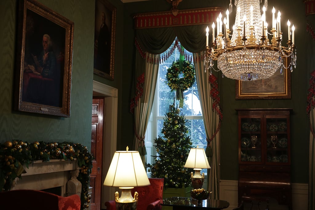 Garlands across the mantel, a wreath hanging from the top of the window, and a modest tree set a surprisingly cozy and inviting tone.