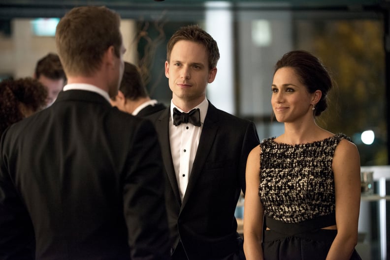 SUITS, (from left): Gabriel Macht (back to camera), Patrick J. Adams, Meghan Markle, 'War', (Season 2, ep. 216, aired Feb. 21, 2013). photo: Christos Kalohoridis / USA Network / Courtesy: Everett Collection