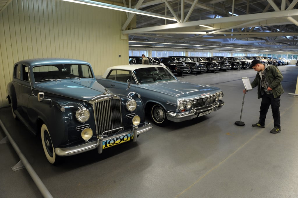 Vintage cars lined a giant garage.