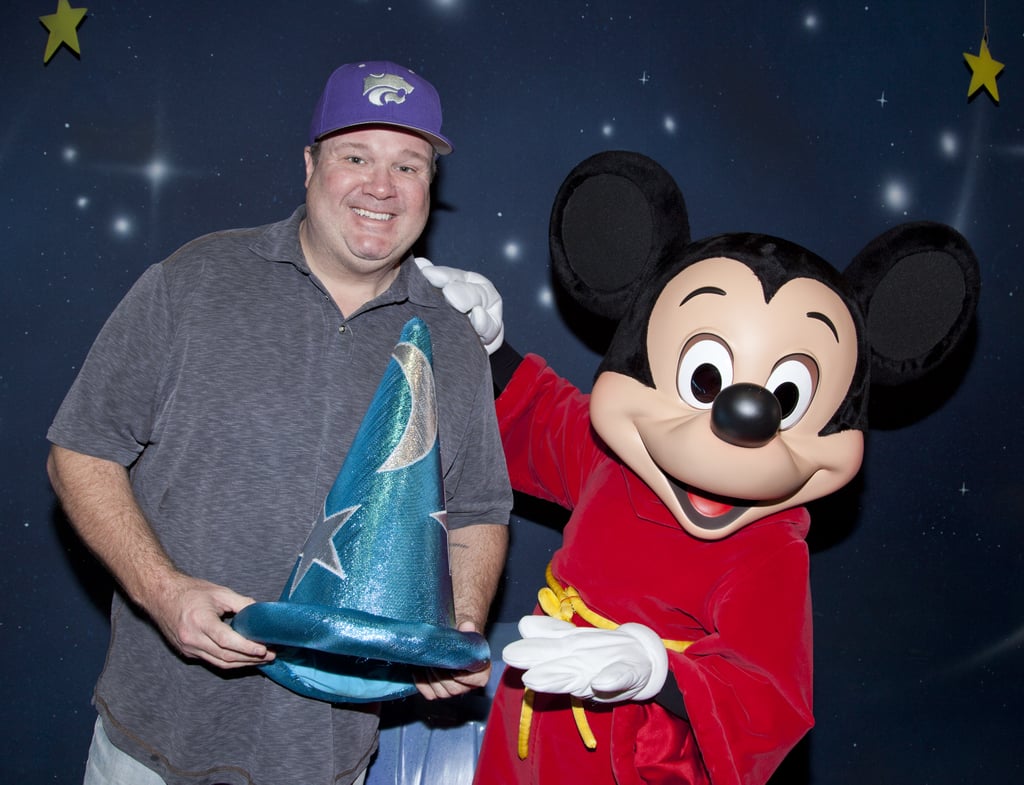 Eric Stonestreet got to hold onto Mickey Mouse's Fantasia hat when he met up with the famous mouse at the park in January 2014.