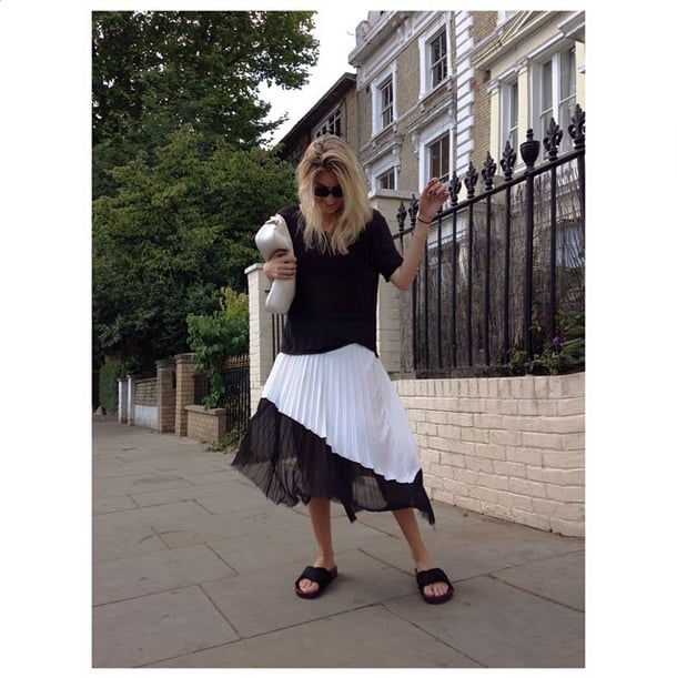 A casual, loose tee doesn't appear so sloppy once it's been layered over a pleated midi skirt.
Source: Instagram user camtyox