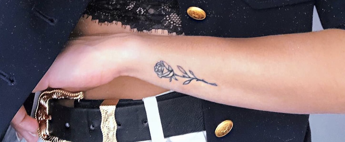 Pink rose tattoo on the wrist