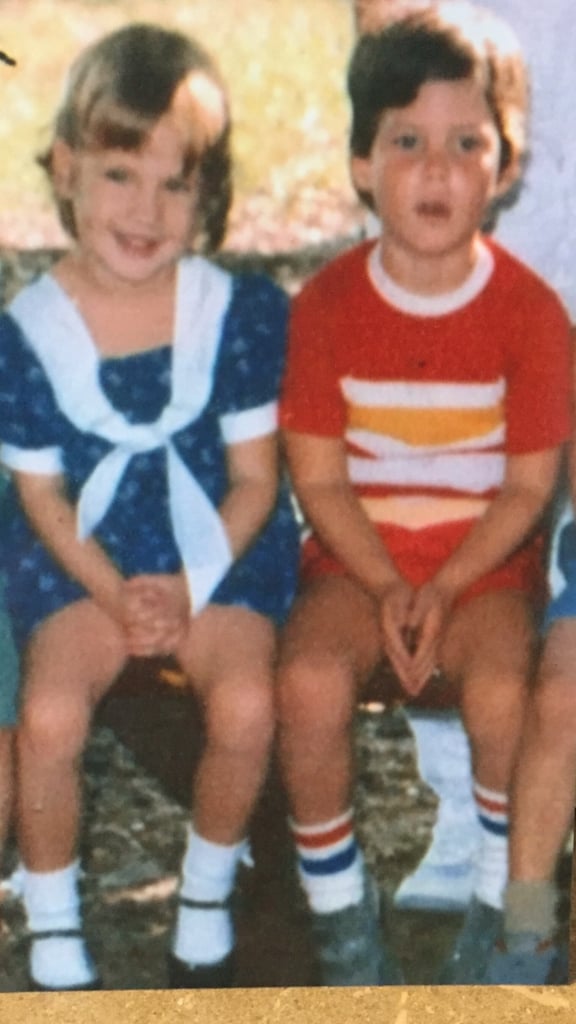 Amy and Justin sitting next to each other at Sunshine Preschool in 1986.