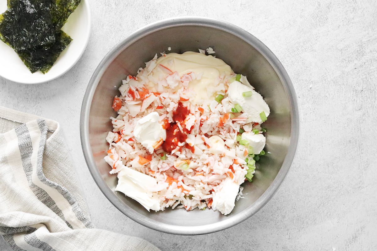 Sushi bake ingredients in a large bowl