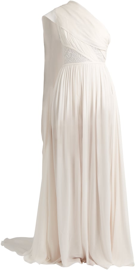 Look like a Grecian goddess on your big day in this beautiful Elie Saab One-Shoulder Lace-Insert Jumpsuit ($4,653). You can style it with a pair of ivory gladiator sandals or statement stilettos.
