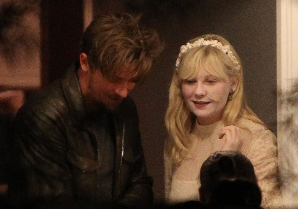 Kirsten Dunst and Garrett Hedlund Handing Out Candy ...