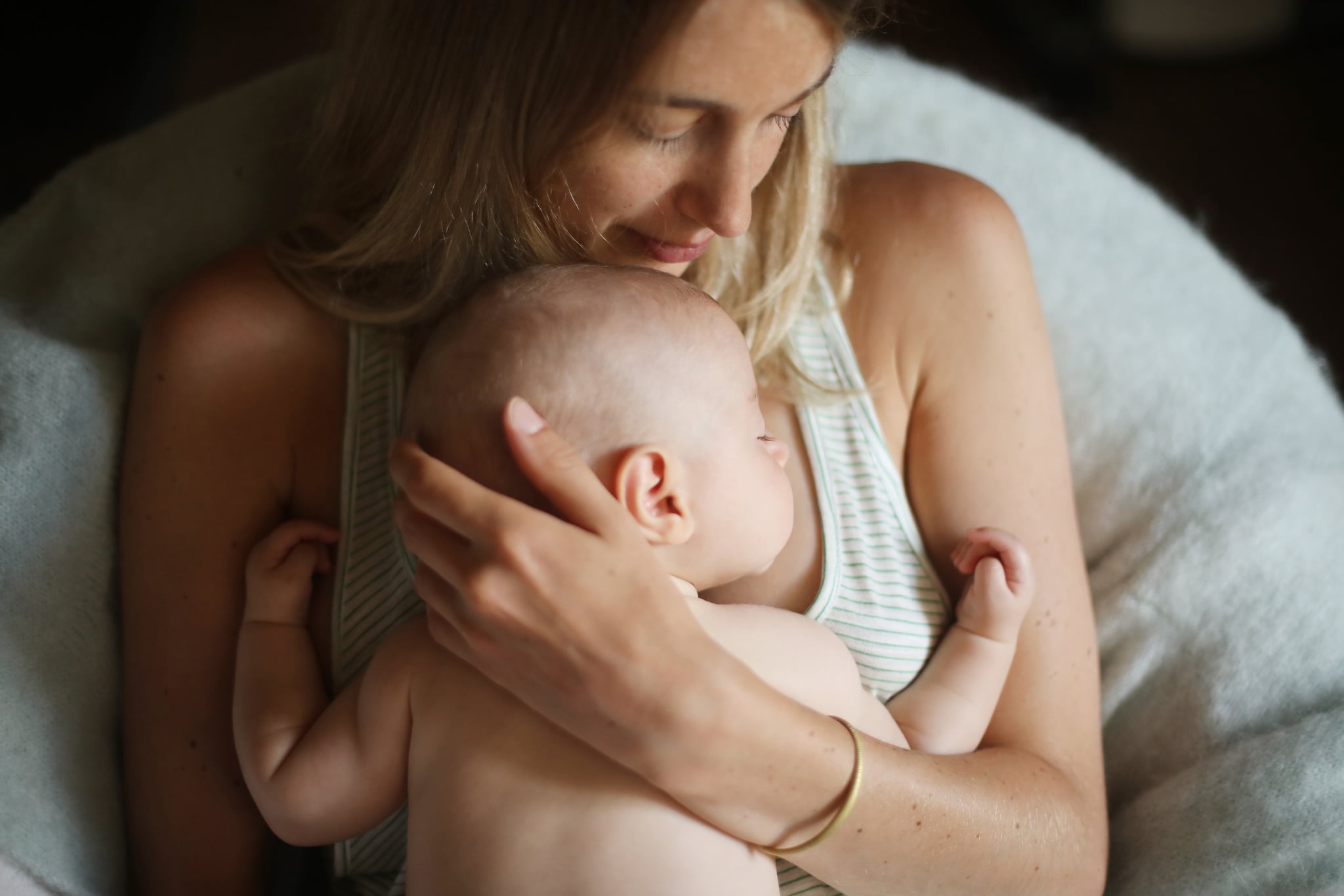 Image of Mom Holding Baby Pressed Against Her Chest