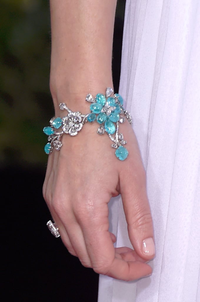 Emily Blunt dressed up her sleek Michael Kors gown with floral jewels, like this ultrafemme bracelet.