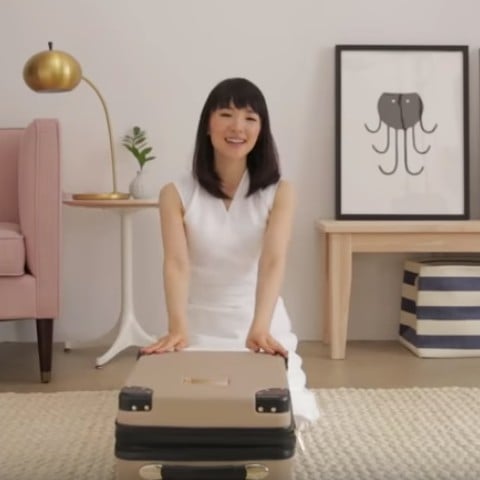 Marie Kondo Packing a Suitcase