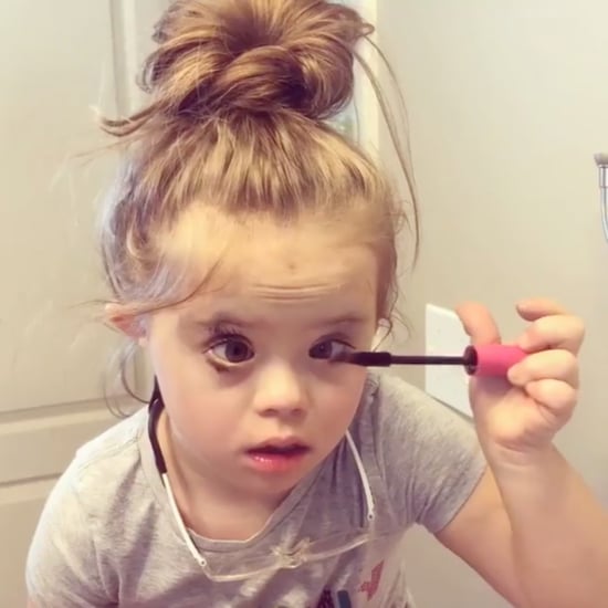 Girl With Down Syndrome Putting on Her Own Makeup