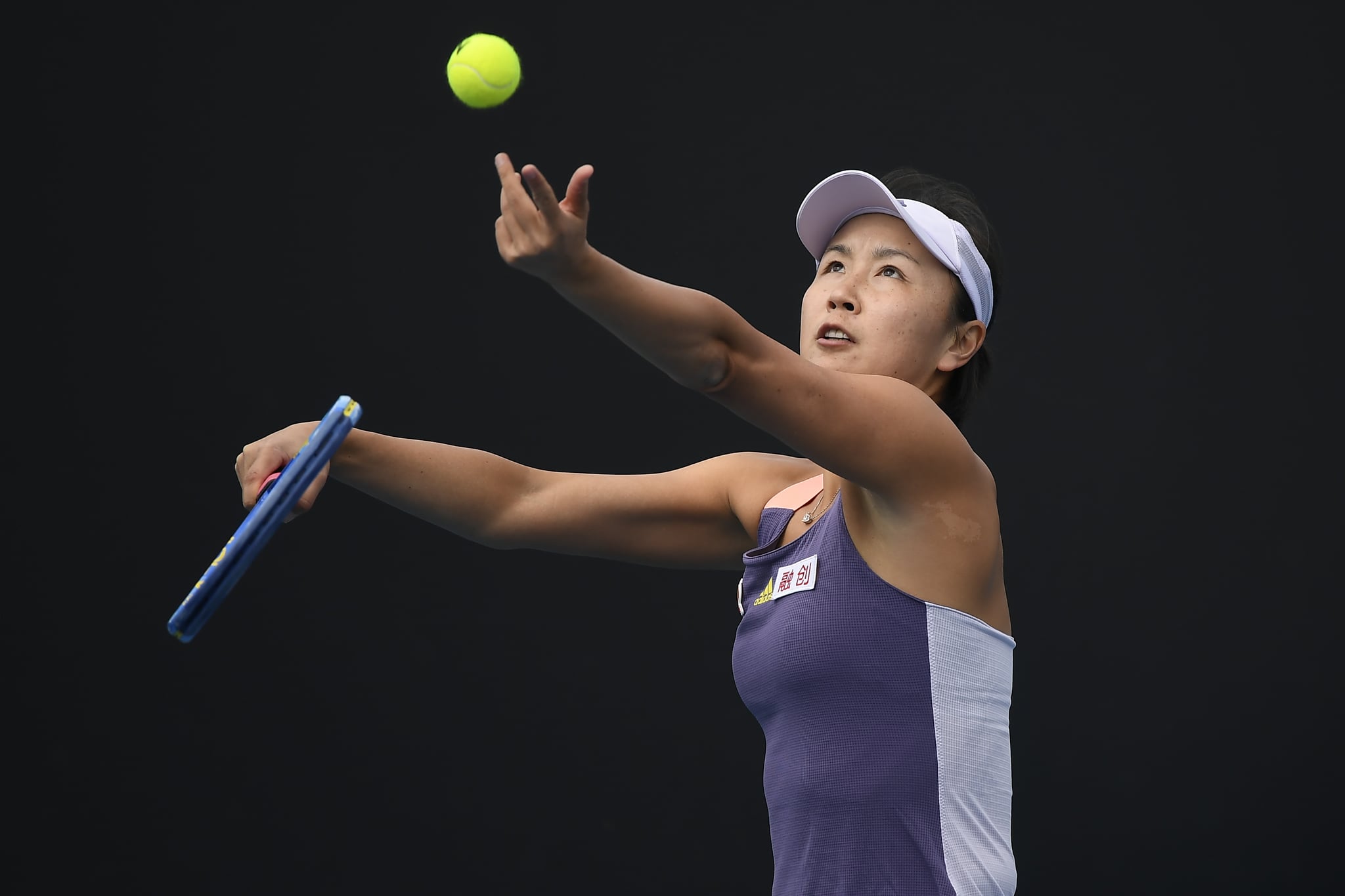 MELBOURNE, AUSTRALIA - JANUARY 21: Shuai Peng of China in action during her Women's Singles first round match against Nao Hibino of Japan on day two of the 2020 Australian Open at Melbourne Park on January 21, 2020 in Melbourne, Australia. (Photo by Fred Lee/Getty Images)