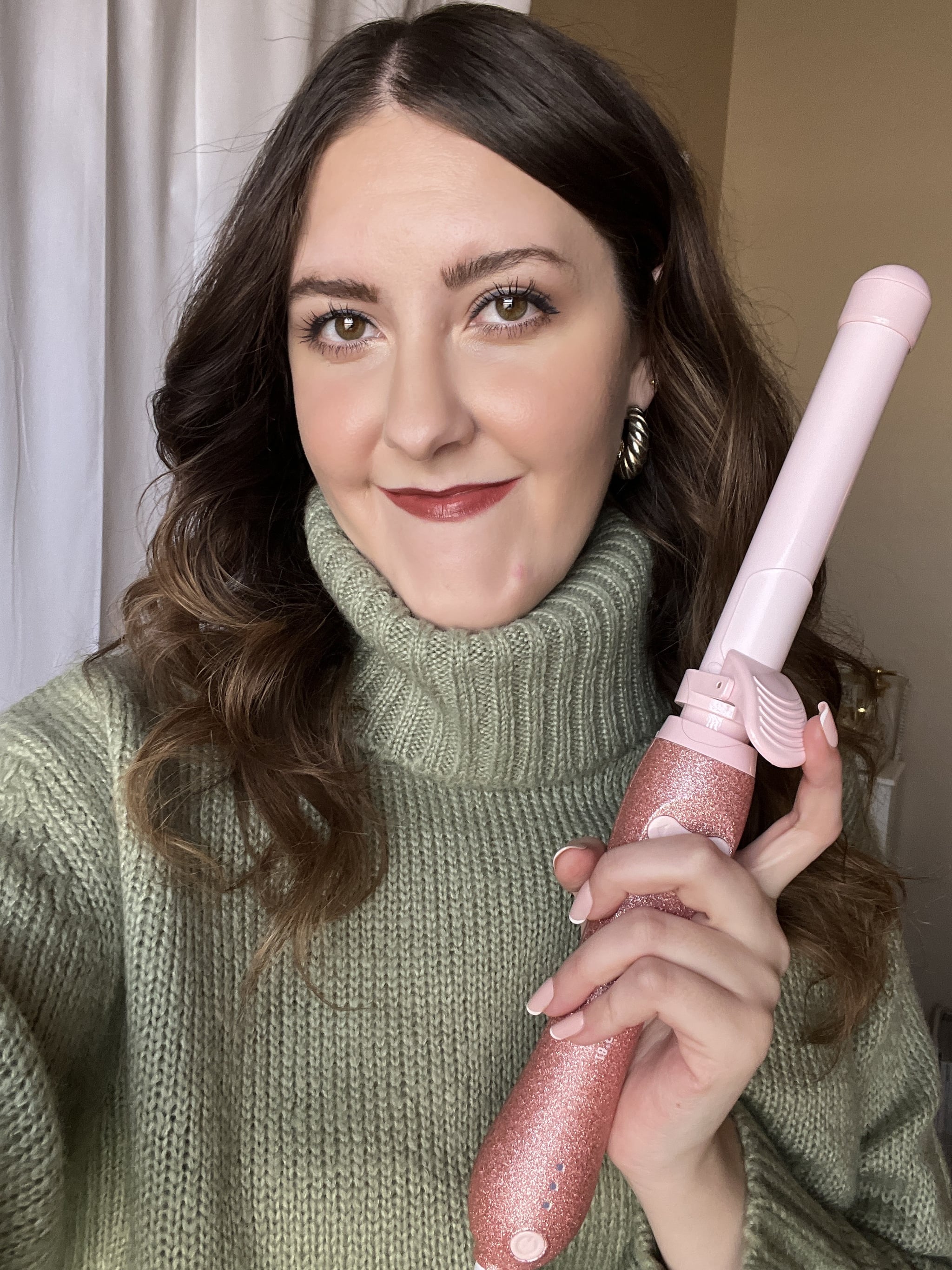 woman holding Beachwaver Curling Iron