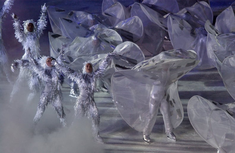 People in tinsel-style costumes hit the ice.