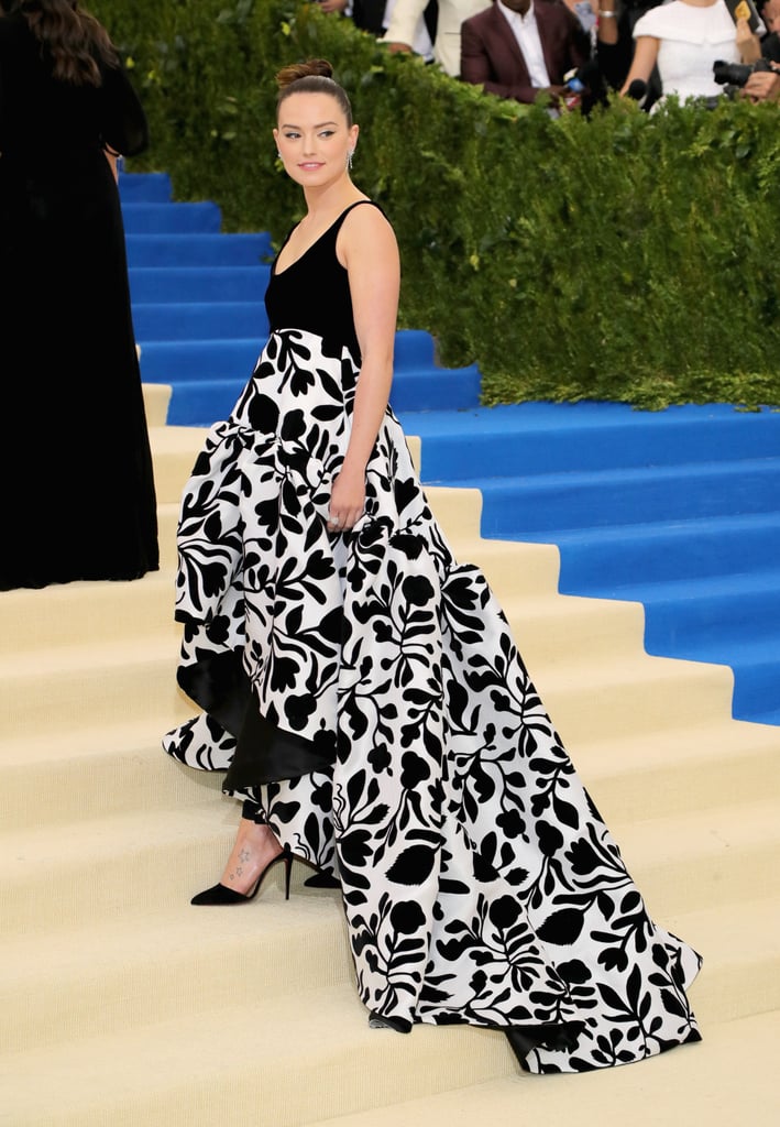 The Dress Featured a High-Low Hemline and Bold Floral Print