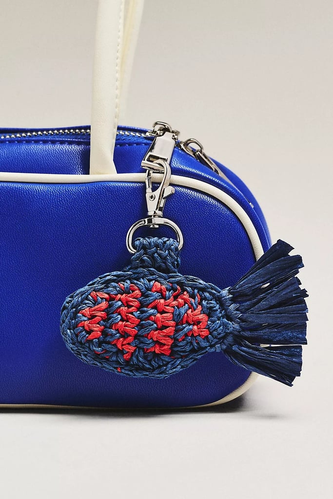Damson Madder Raffia Fish Bag Charm ($40, originally $50)
In my humble opinion, the limit does not exist when it comes to curating a bag charm collection. By adding a nautical touch to your go-to purse with this blue-and-red fish, you can keep the spirit of summer alive all year long.