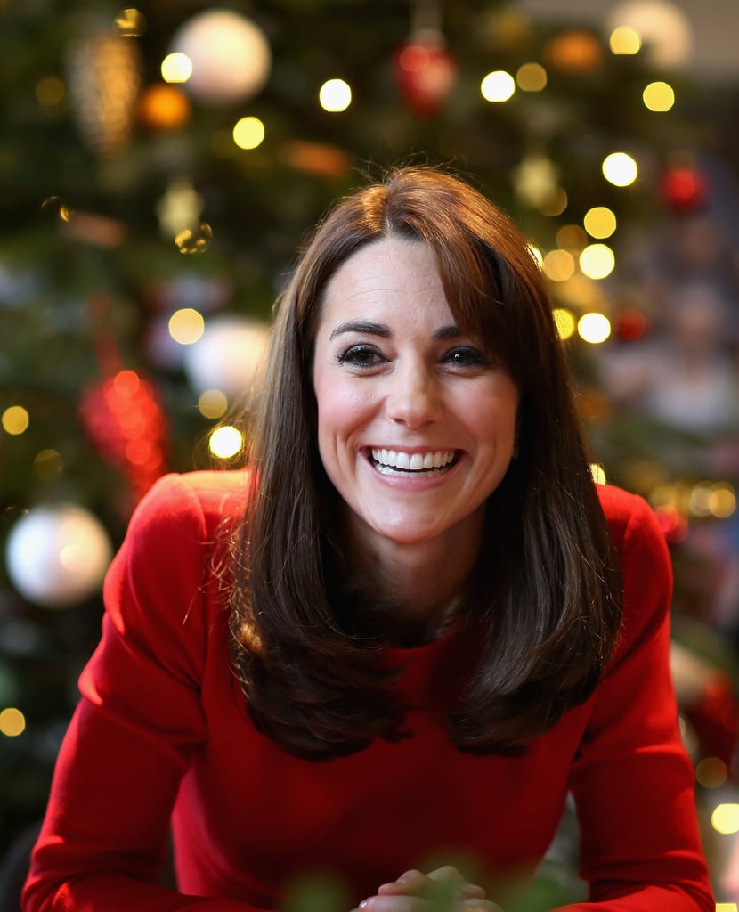 Kate glowed in her bright design as she visited the children at the Anna Freud Centre Family School for a Christmas party.